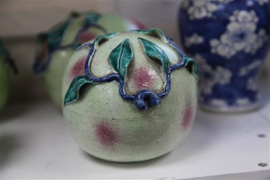 A pair of Chinese enamelled porcelain models of peaches, 19th century, length 16.5cm